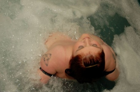 skinny tattooed milf with big ass spreads her pussy in reverse cowgirl porno pic