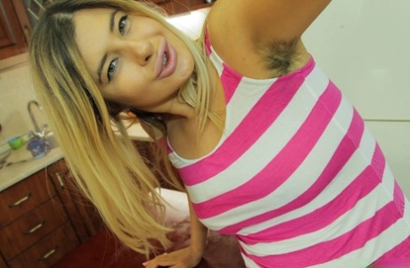 smiling curvy teen licking her big boobies in close up art porn photo